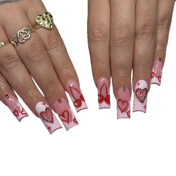 Artificial nail set with romantic heart designs and sparkling rhinestone decorations Kalsten