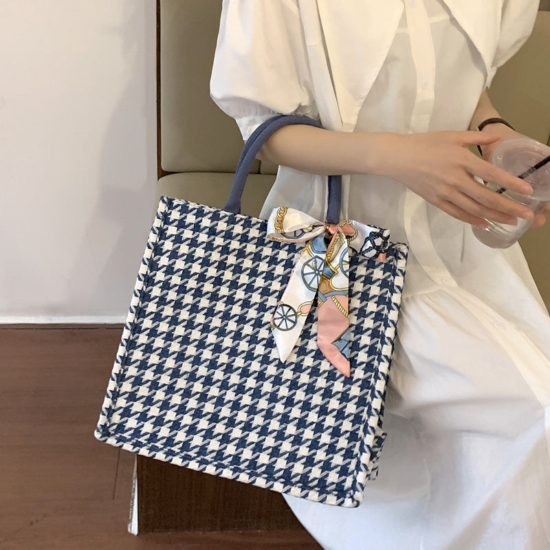 Elegant Houndstooth Handbag with Decorative Bow