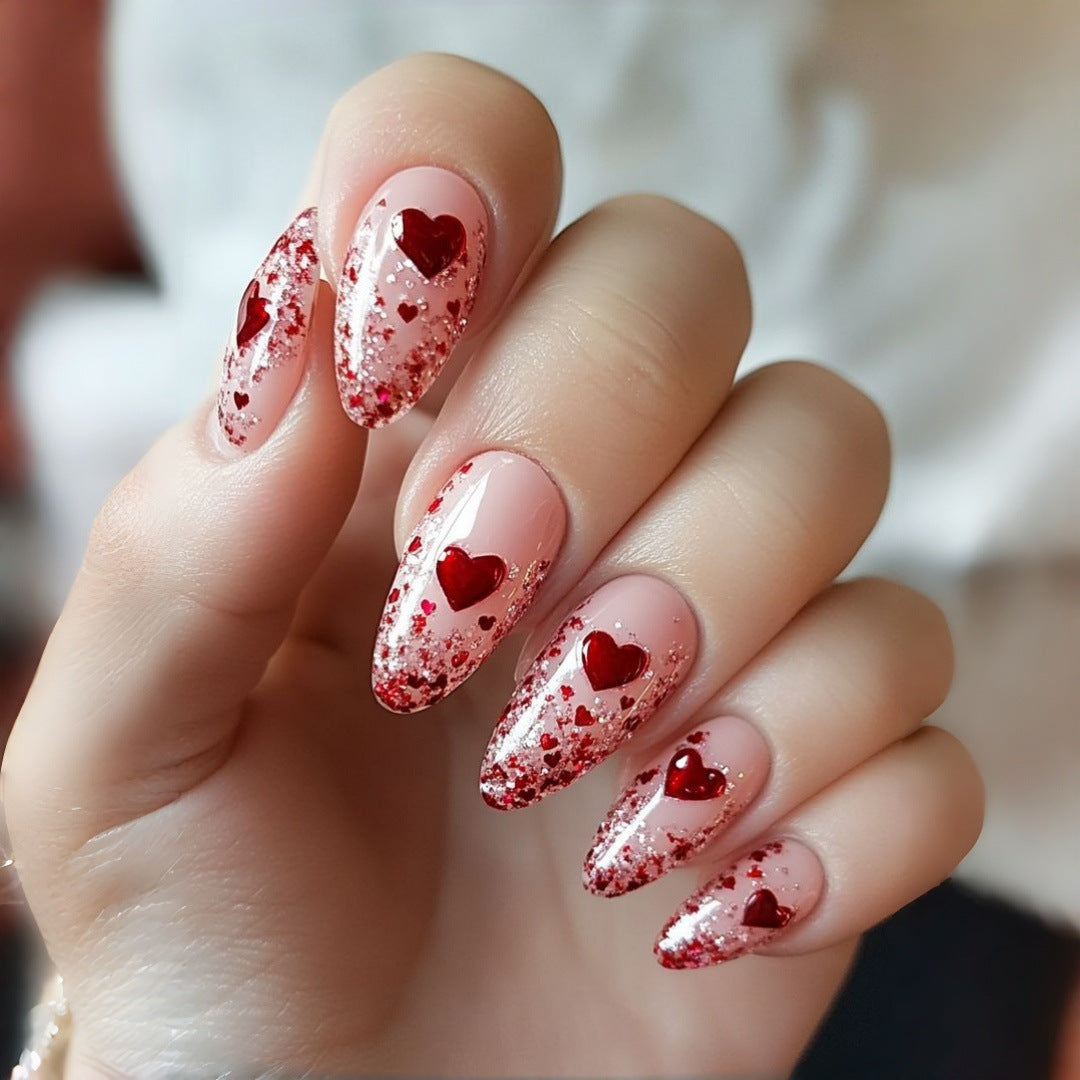 Glamorous artificial nails with heart design and glitter Kalsten