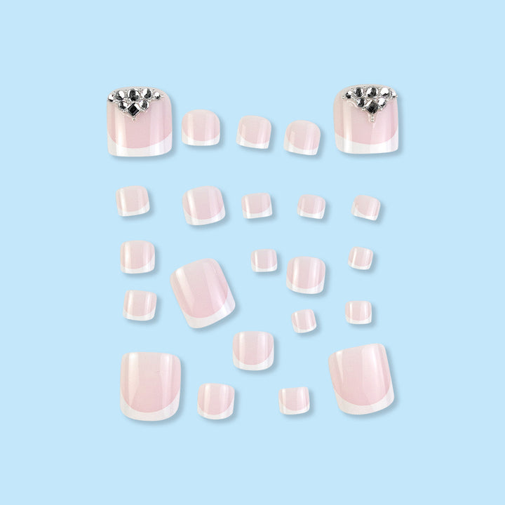 Nail art set with elegant French tips and sparkling rhinestone details Kalsten