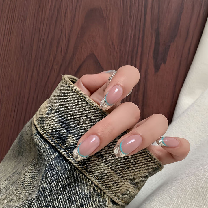 Artificial nails with shimmering glitter and elegant French-tip design Kalsten
