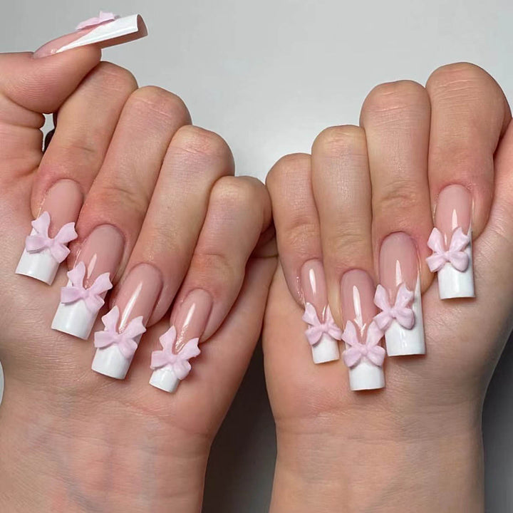 Artificial nails with playful bow design Kalsten