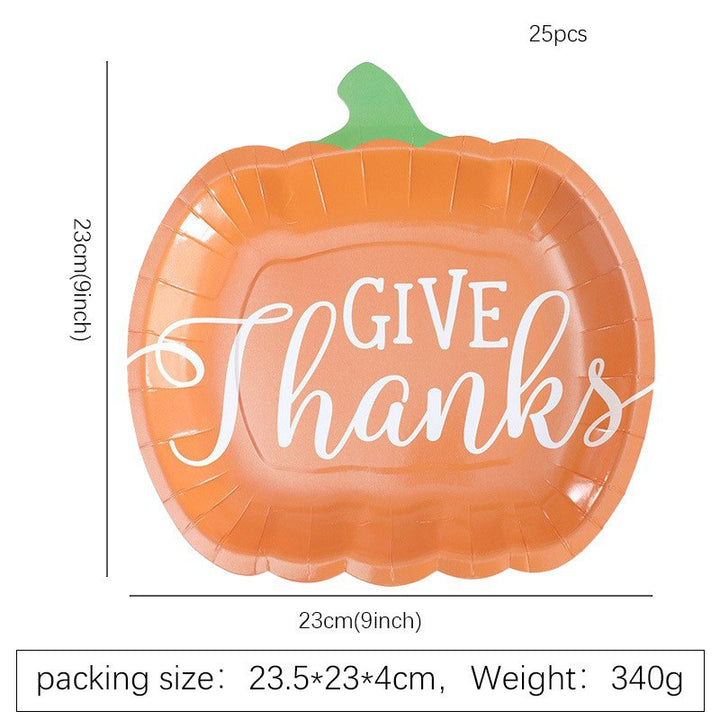 Disposable paper plates in pumpkin shape with spooky face design