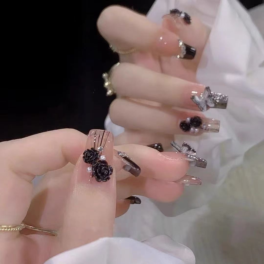 Elegant nail design with bow and rhinestone details Kalsten