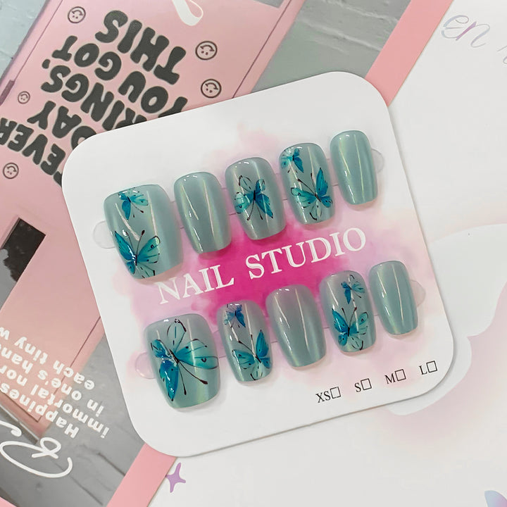 Artistic acrylic nails with butterfly motif Kalsten