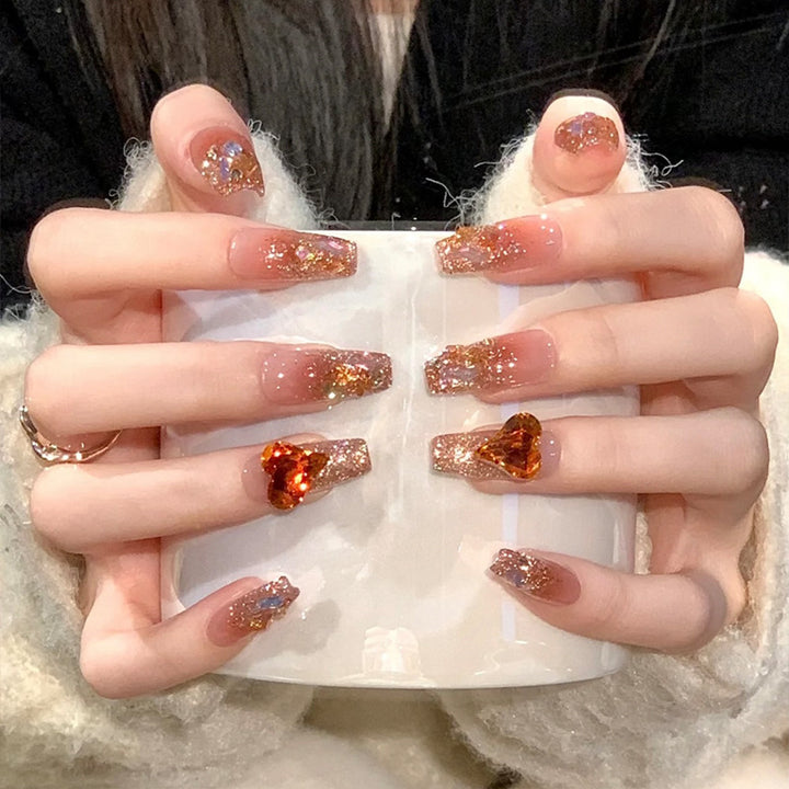 Artificial nail set with glitter and heart accents Kalsten