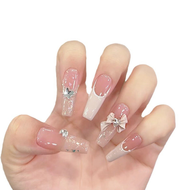 Artificial nails with glitter accents and playful motifs Kalsten