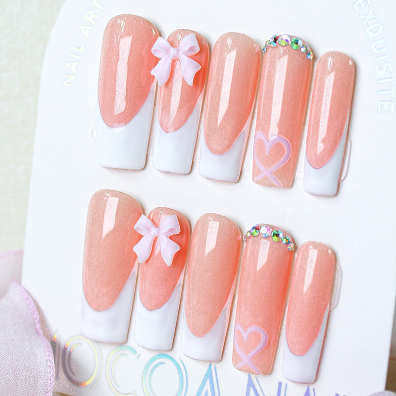 Artifical nail set with playful bow and heart designs Kalsten