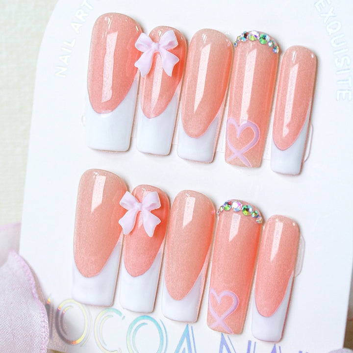 Artifical nail set with playful bow and heart designs Kalsten