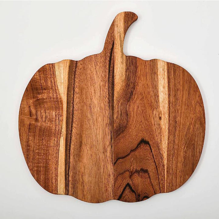 Wood cutting board in pumpkin silhouette made of acacia wood with ergonomic handle