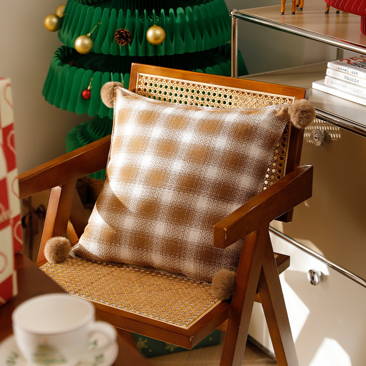 Square living decorative pillow with woven check structure and pom-pom corners