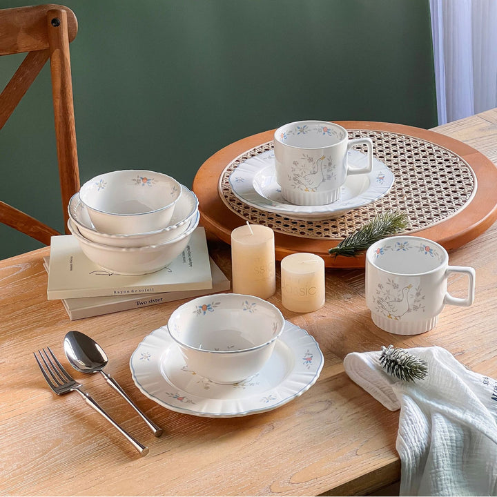 Decorative porcelain soup plate with ribbed edge and duck motif