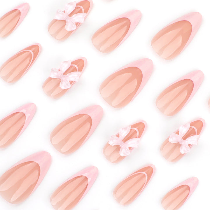 Artistic Nail Extensions with Transparent Bow Accents Kalsten