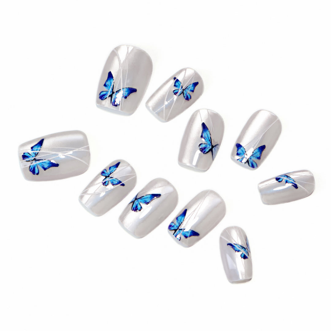 Creative nail extensions with intricate butterfly design Kalsten