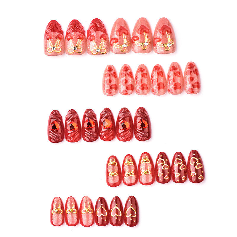 Festive artificial nails with romantic heart designs Kalsten