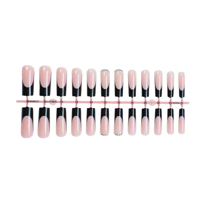 Nail set with elegant black and white colors and glitter accents Kalsten
