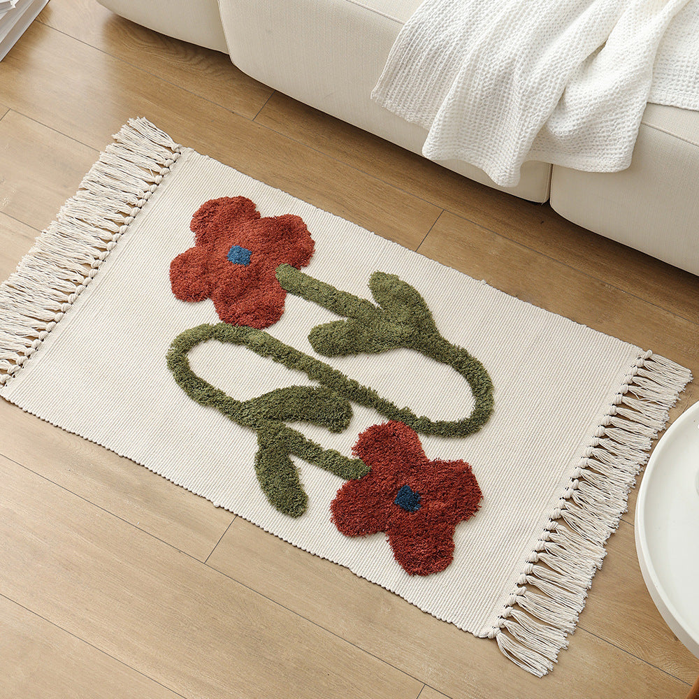 Handwoven cotton bath mat rug with tufted flower appliqué and tassels Kalsten