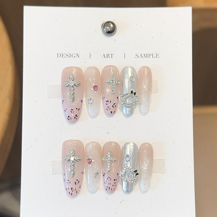 Artificial nails with sparkling rhinestones and cross motifs Kalsten