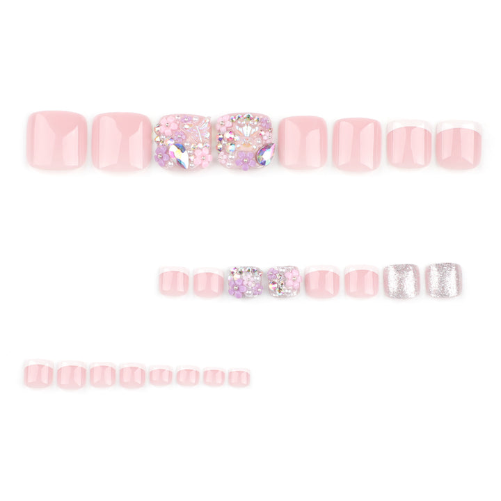 Artistic toenail art with floral accents and glitter Kalsten