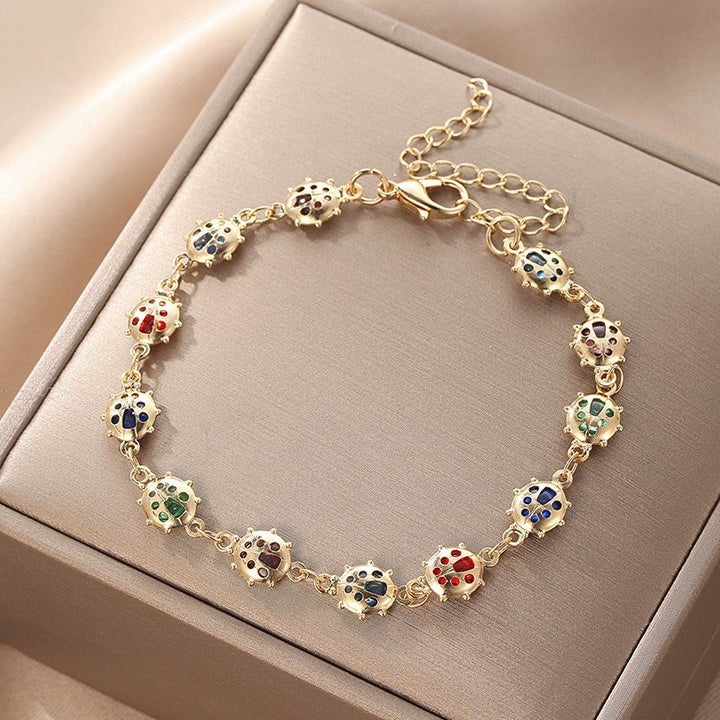 Butterfly and Daisy Charm Anklet Kalsten