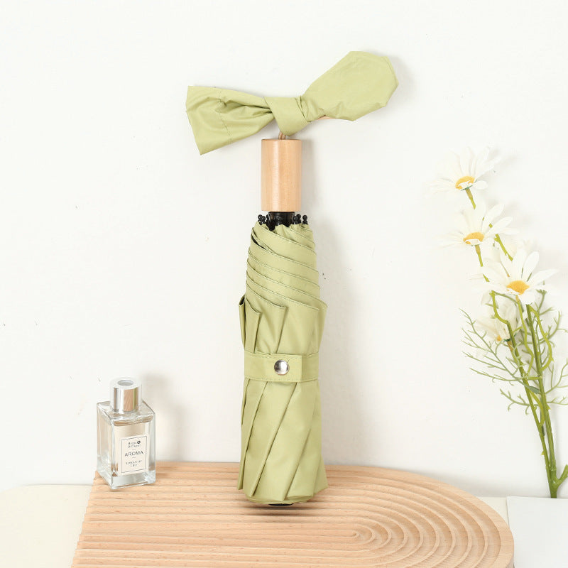 Ladies compact folding umbrella with elegant design and ergonomic wooden handle Kalsten