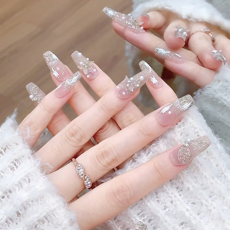Glamorous artificial nails with heart-shaped accents Kalsten