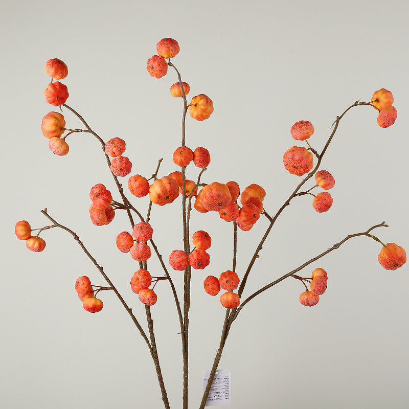 Artificial decorative branch with dried-looking pumpkin balls and flexible wire stem