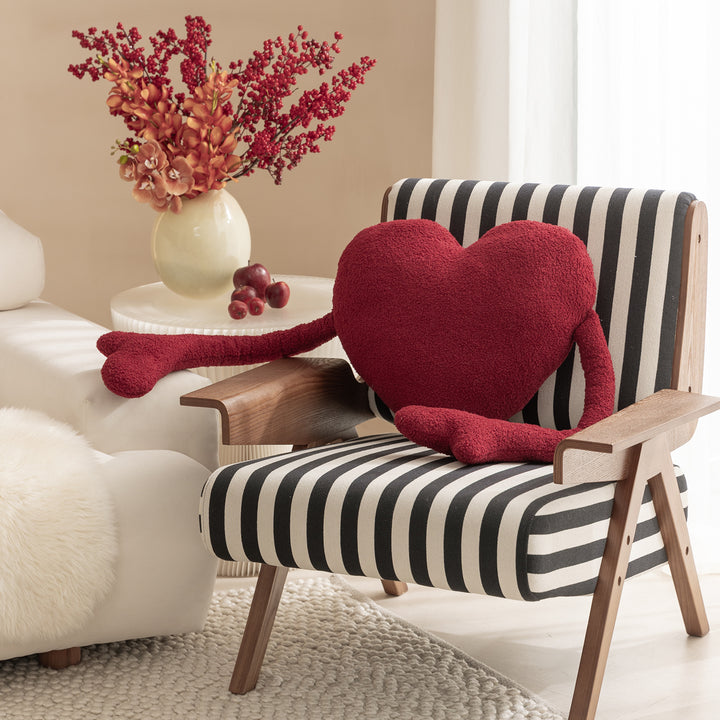 Heart-shaped cuddle cushion with extended arm applications Kalsten