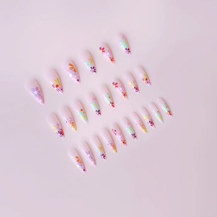 Acrylic nail set with vibrant floral designs and sharp accents Kalsten