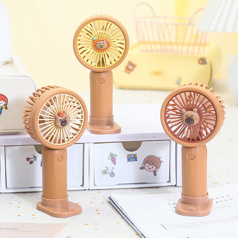 Unisex portable rechargeable battery hand fan with USB charging station and child-safe bear design Kalsten