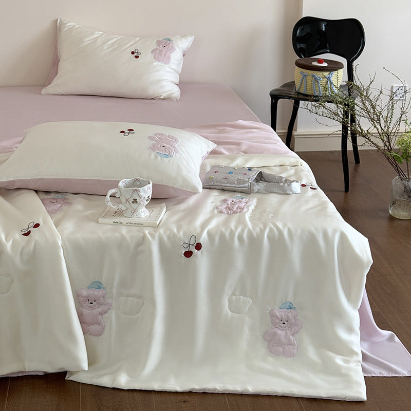 Satin bedding set with playful whale print and silky shiny surface