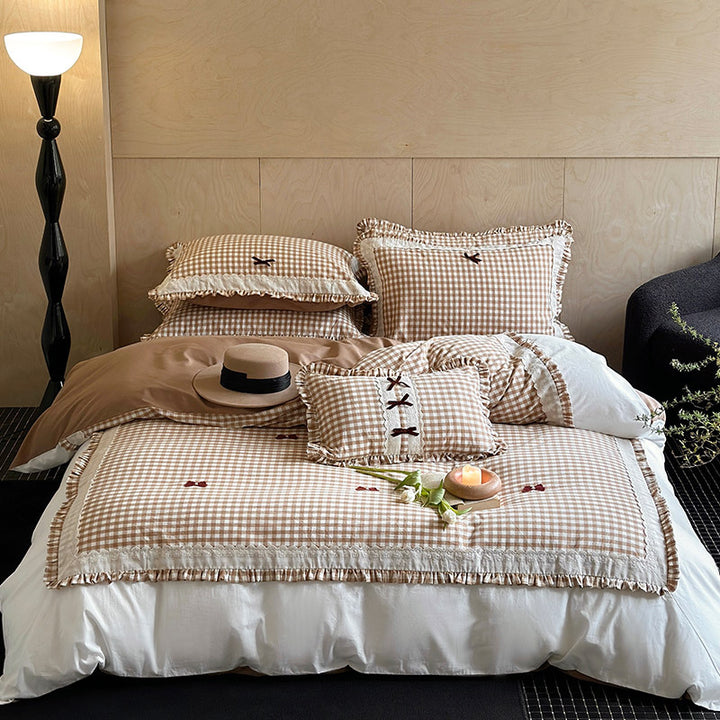 Bedding set in country house style with Vichy check, ruffle and embroidery appliqués