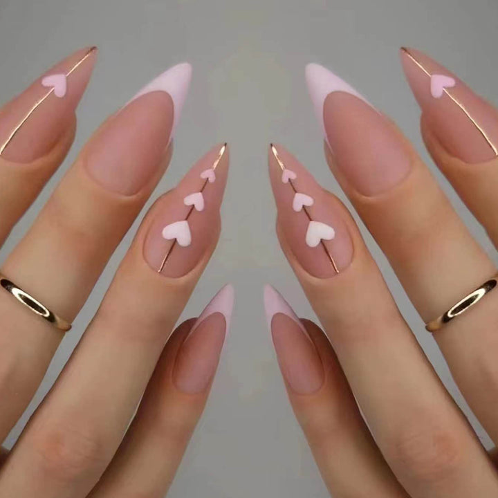Artful stiletto nails with heart-shaped accents Kalsten