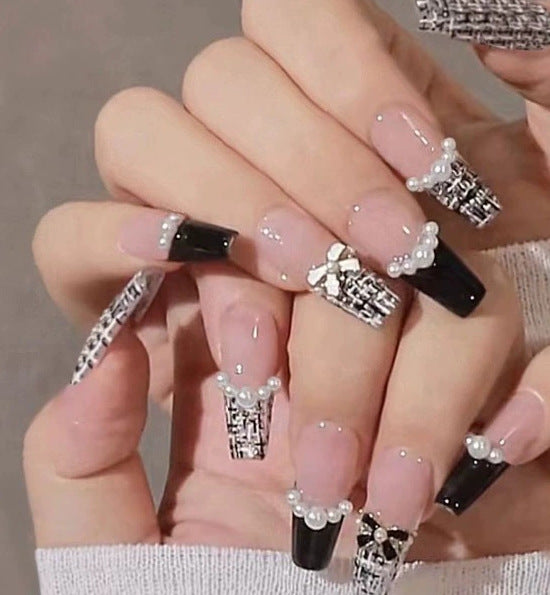 Elegant nail design with pearl embellishment Kalsten