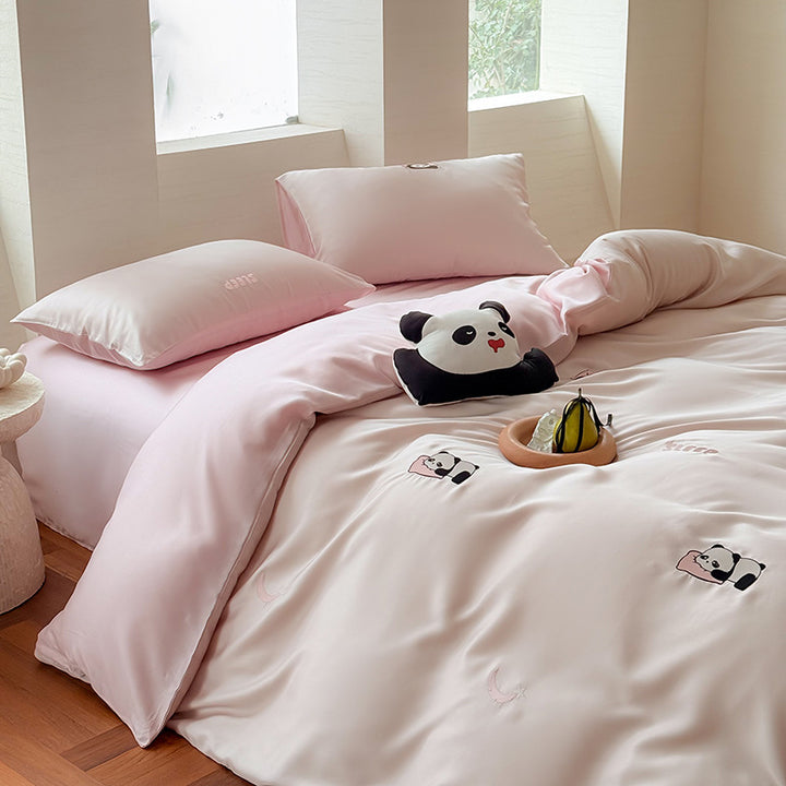 Luxurious satin bedding set with embroidered cherry motifs, reversible function and plush bunny pillow