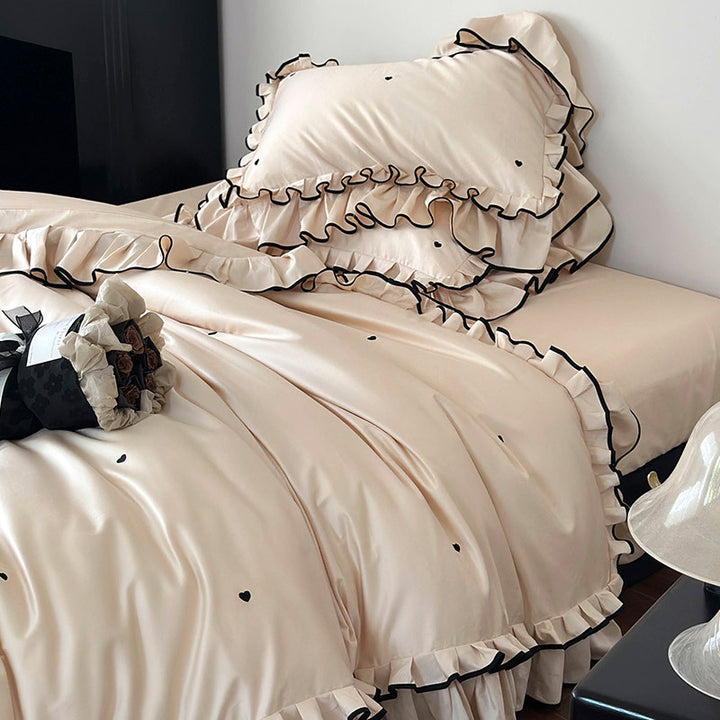 Cotton satin bed set with double-layer ruffled trim, contrast edge and heart embroidery