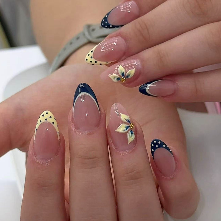 Artful nail tips with floral accent Kalsten