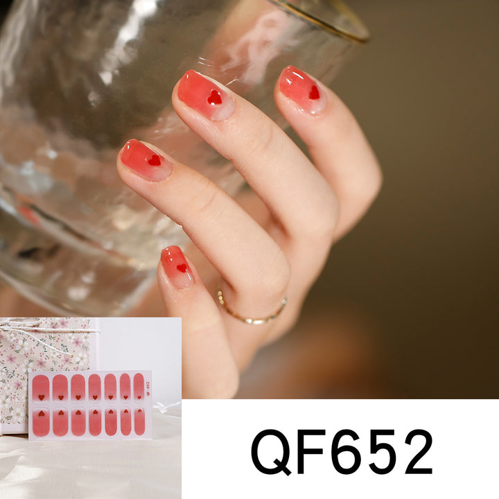 Artificial nail art with heart-shaped designs and soft color gradients Kalsten
