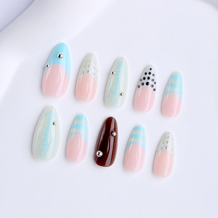 Artificial stiletto nails with glamorous applications Kalsten