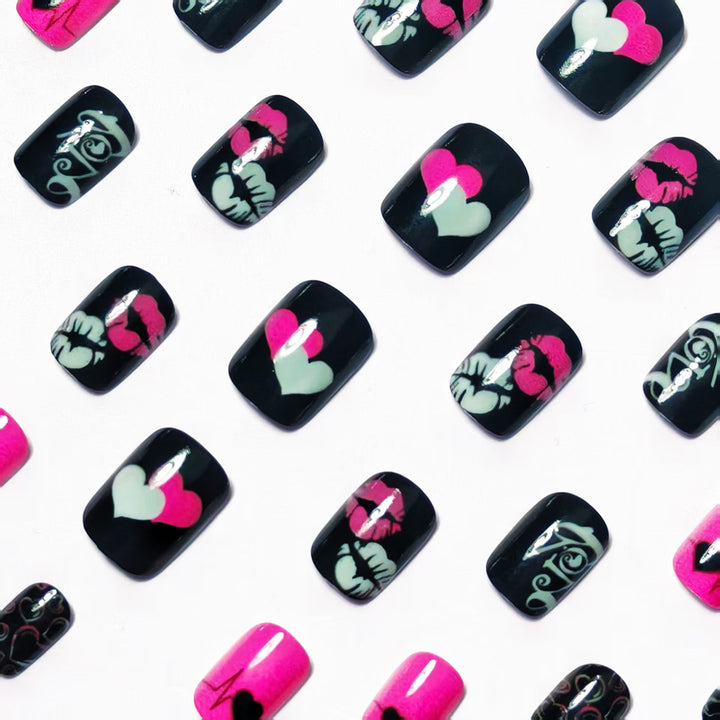 Acrylic nail design with hearts and kiss motifs Kalsten