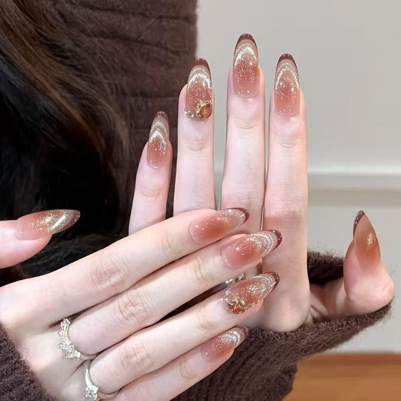Glamorous art nails with glitter and stone accents Kalsten