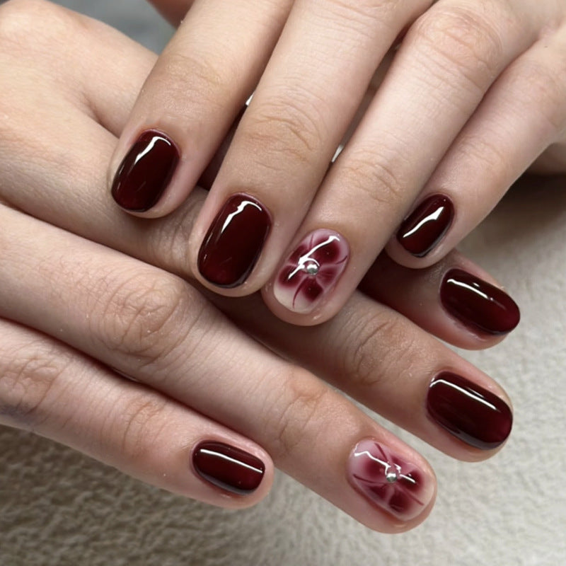 Elegant Nail Art with Glitter and Flower Elements Kalsten
