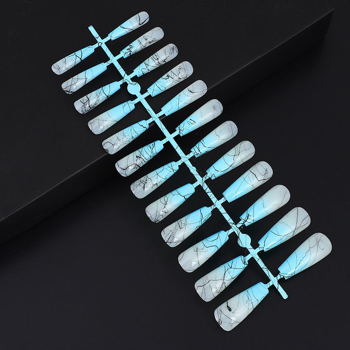 Artificial nails in modern ombre design with marbled accents Kalsten
