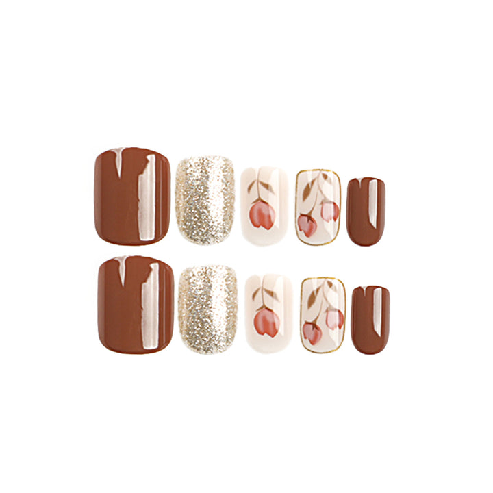 Artificial nail art with colorful flower design and glitter accents Kalsten