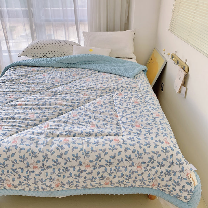 Cozy baby quilt with minky fleece border and cute rabbit print