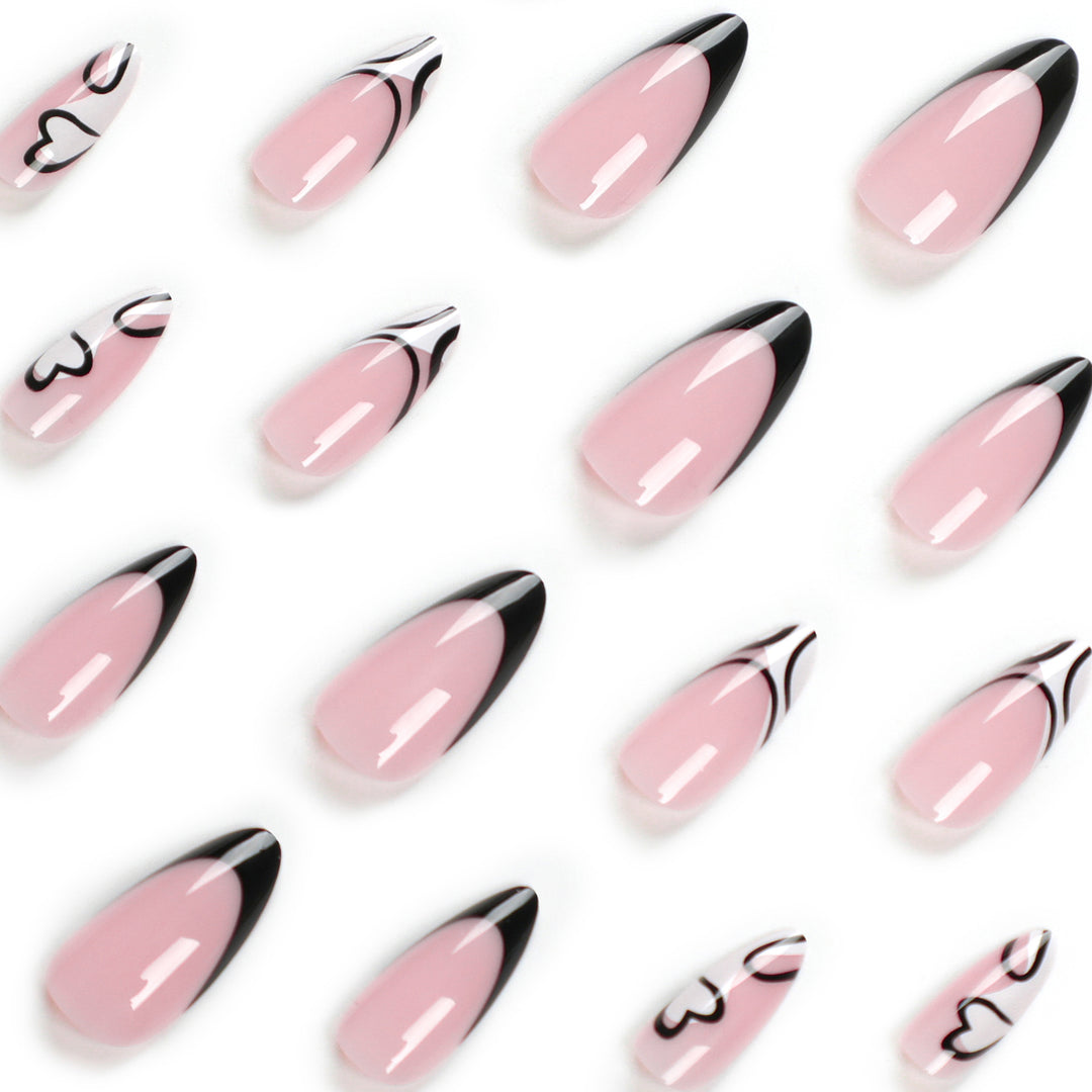 Artful stiletto nails with elegant black-and-white design Kalsten