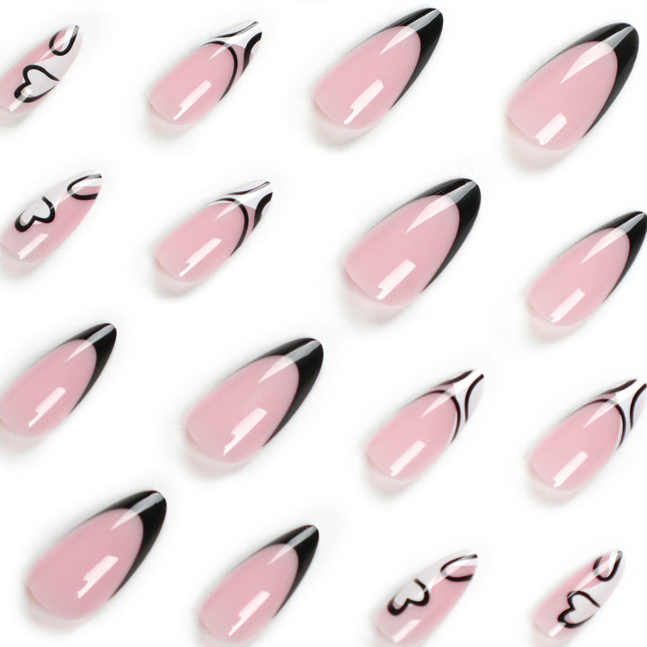 Artful stiletto nails with elegant black-and-white design Kalsten