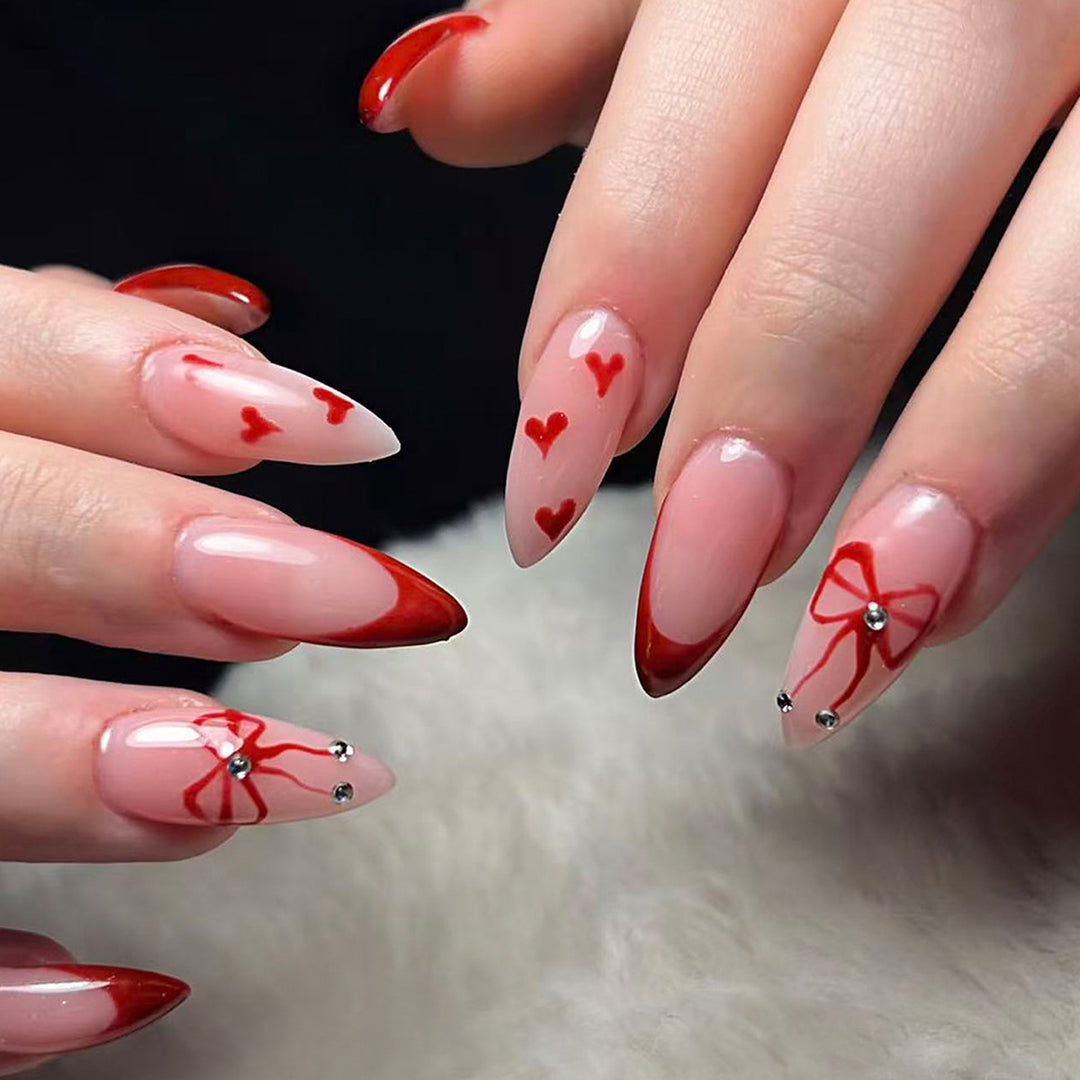 Artificial nails with elegant heart designs and glamorous accents Kalsten
