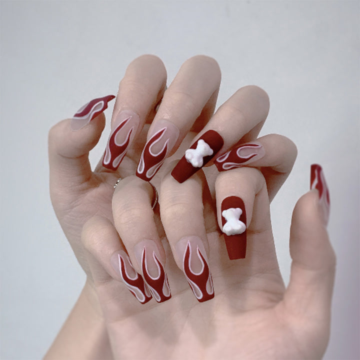 Artful stiletto nails with fiery flame design Kalsten