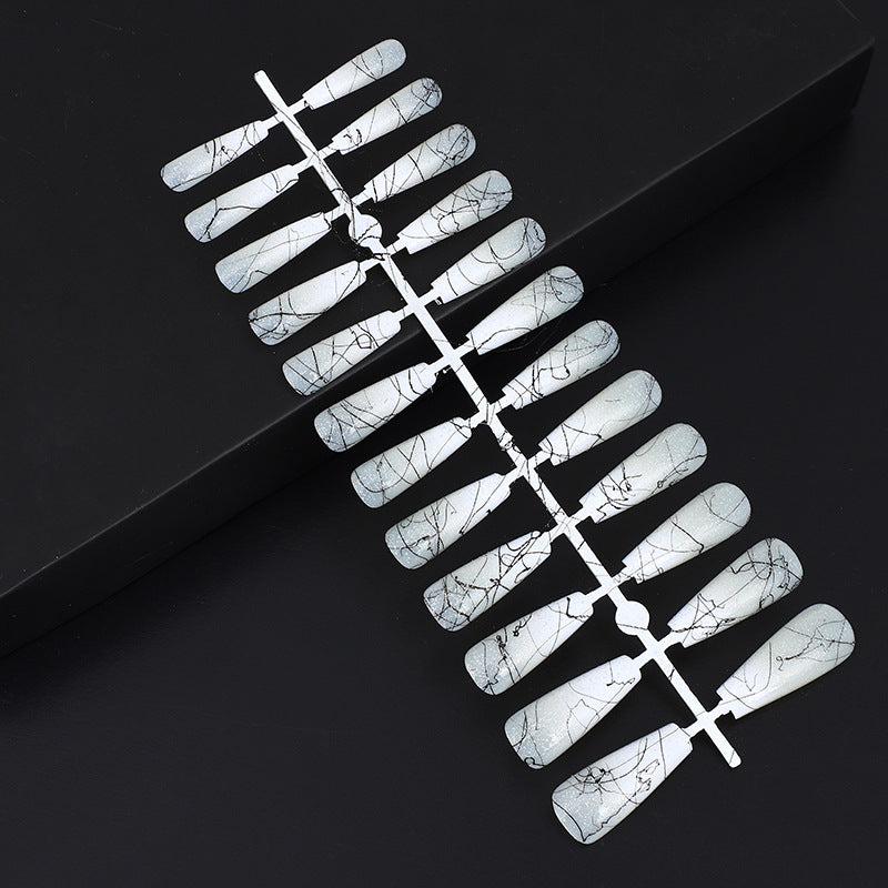 Artificial nails in modern ombre design with marbled accents Kalsten